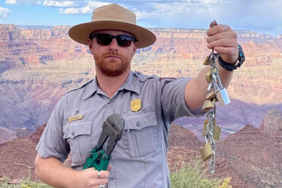 <p>NPS Photos / D. Pawlak</p> A national park ranger photographed holding love locks