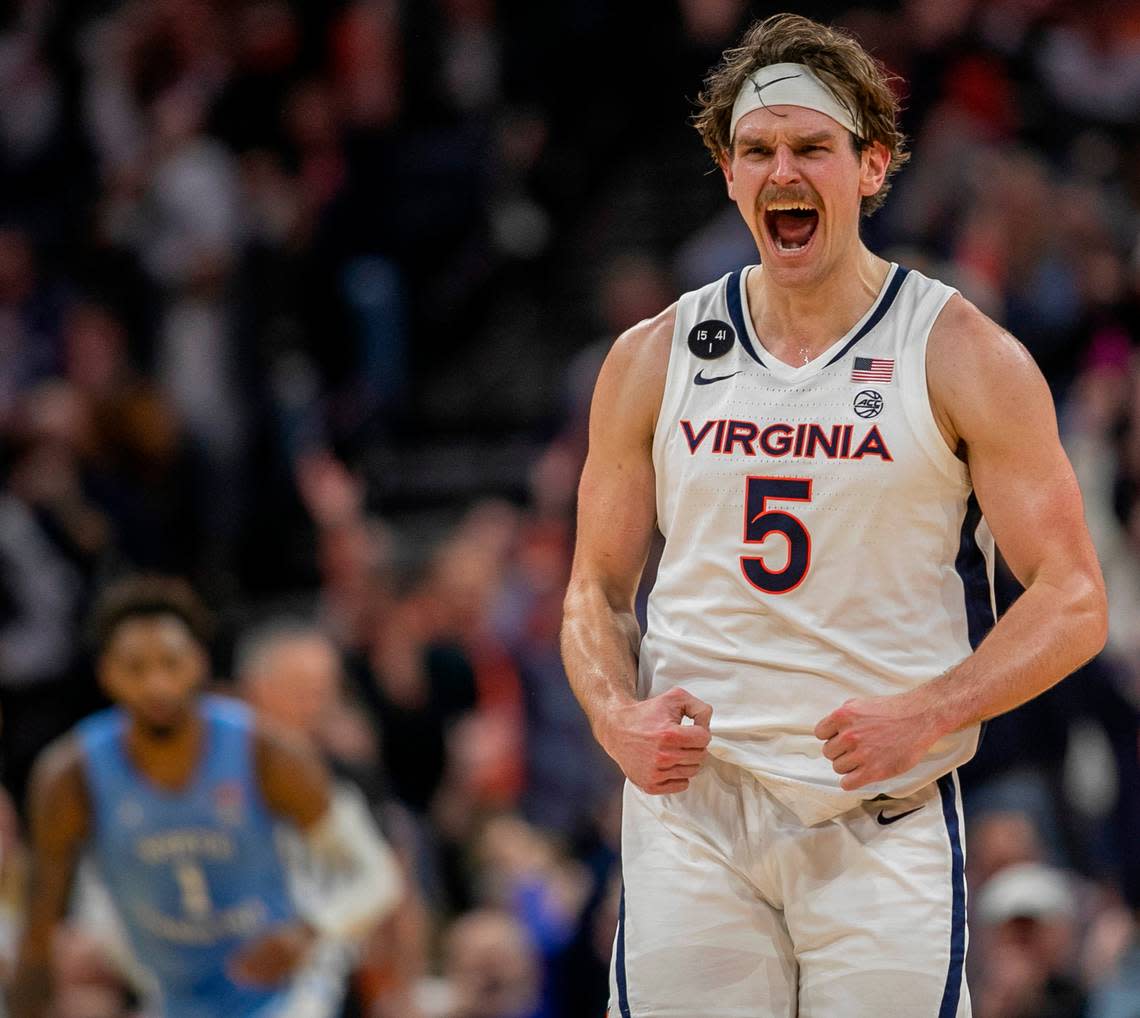 Virginia’s Ben Vander Plas (5) reacts after sinking a three point basket to give the Cavaliers a 52-42 lead over North Carolina in the second half on Tuesday, January 10, 2023 at John Paul Jones Arena in Charlottesville, Va.