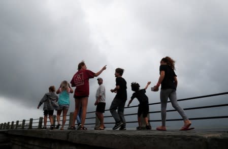 A family visits the waterfront area ahead of the arrival of Hurricane Dorian in Charleston