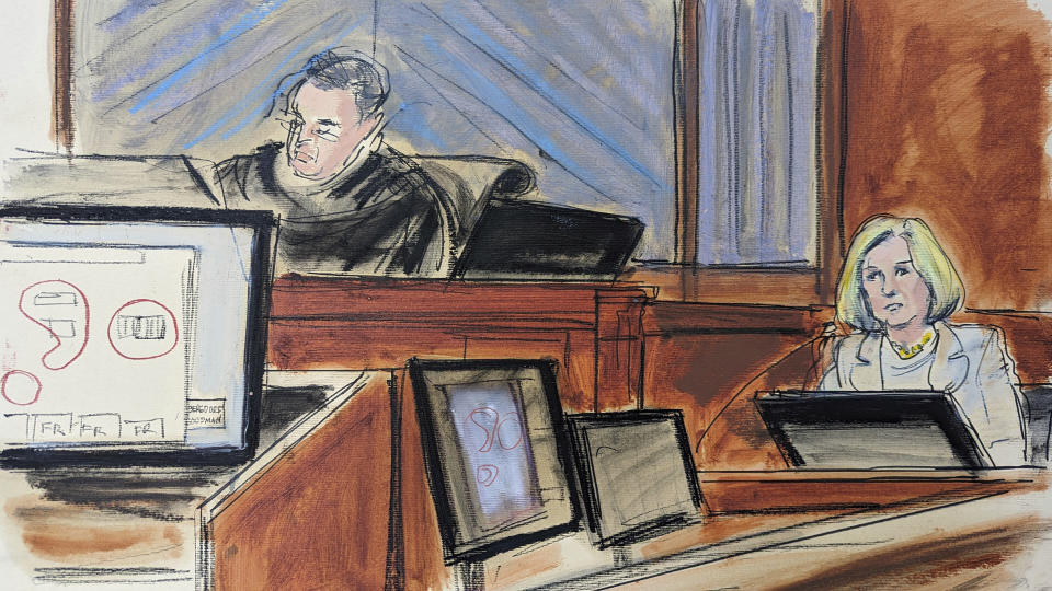 In this courtroom sketch, former Bergdorf Goodman store manager Cheryl Beall describes, in Federal court, in New York, Wednesday, April 26, 2023, the 6th floor of the store where the alleged assault of writer E. Jean Carroll occurred. Carroll, a writer suing former President Donald Trump, took the stand to tell jurors that the future president raped her after she accompanied him into a department store fitting room in 1996. Judge Lewis Kaplan presides, upper left. (AP Photo/Elizabeth Williams)