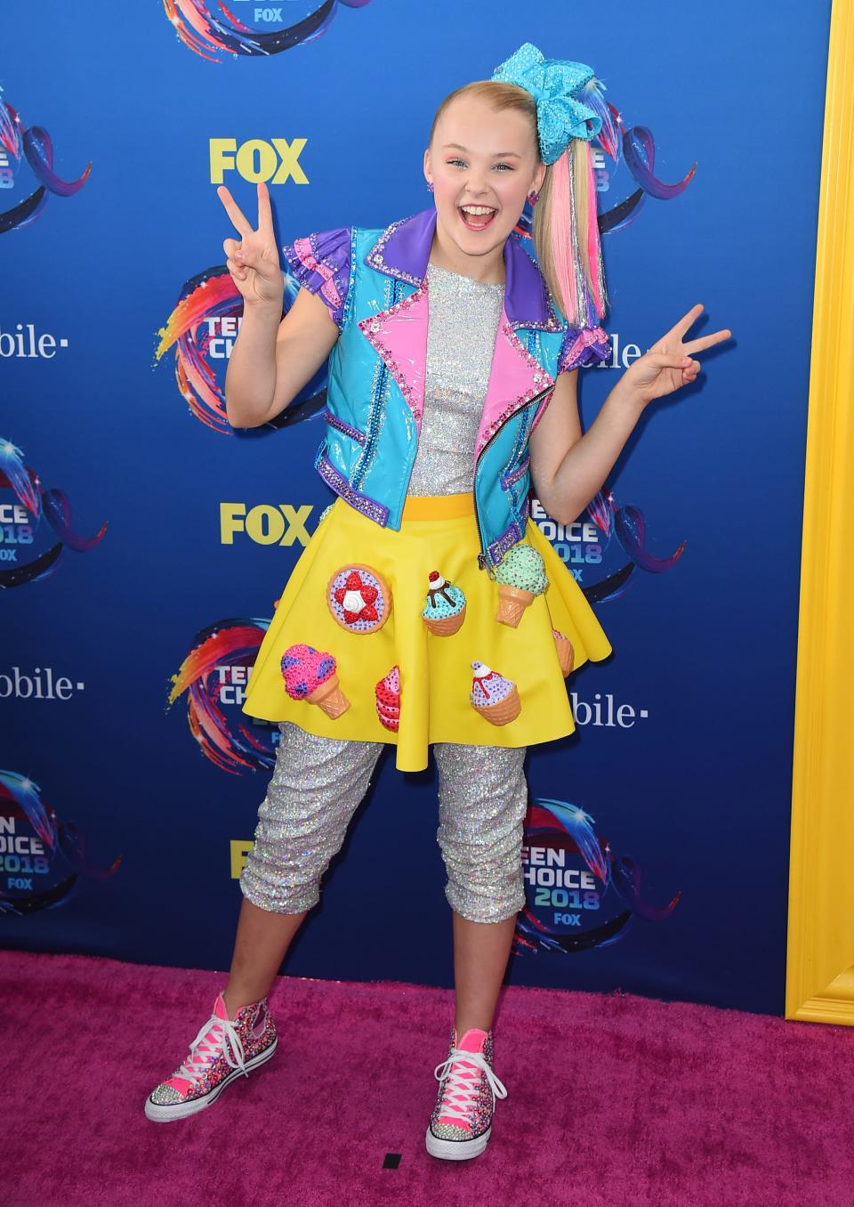 JoJo Siwa arrives at the Teen Choice Awards at The Forum on Sunday, Aug. 12, 2018, in Inglewood, Calif. (Photo by Jordan Strauss/Invision/AP) ORG XMIT: CAPM116