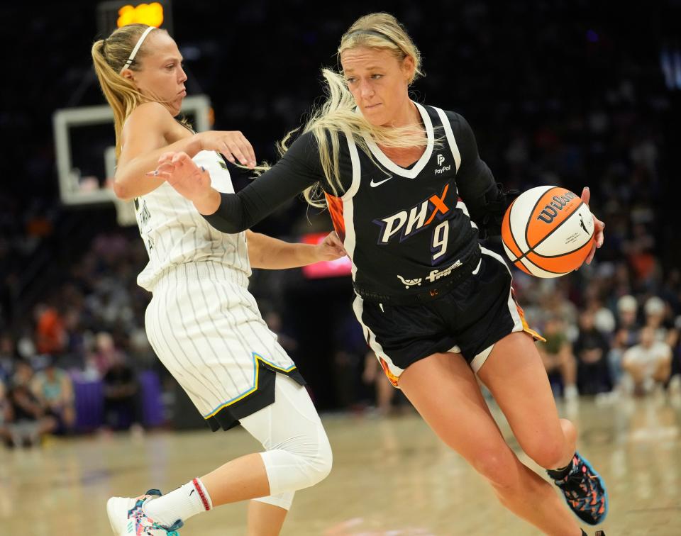 Aug 14, 2022; Phoenix, Ariz. U.S.;  Phoenix Mercury guard Sophie Cunningham (9) drives against Chicago Sky guard Julie Allemand (20) during the first quarter at Footprint Center. Mandatory Credit: Michael Chow-Arizona Republic