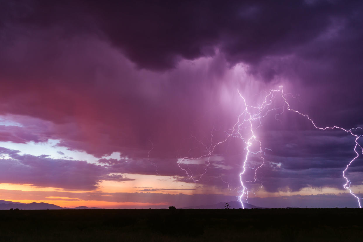 Lightning bolt striking from a sunset storm near Benson, Arizona.