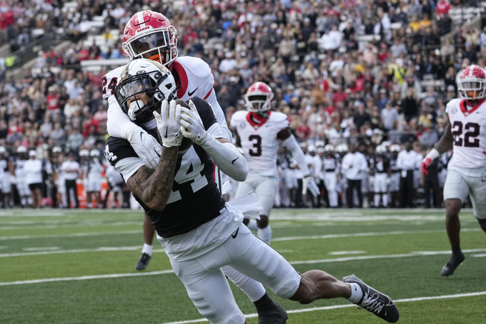 Vanderbilt wide receiver Will Sheppard makes a catch in front of Georgia defensive back Malaki Starks (24) in the second half of an NCAA college football game Saturday, Oct. 14, 2023, in Nashville, Tenn. (AP Photo/George Walker IV)