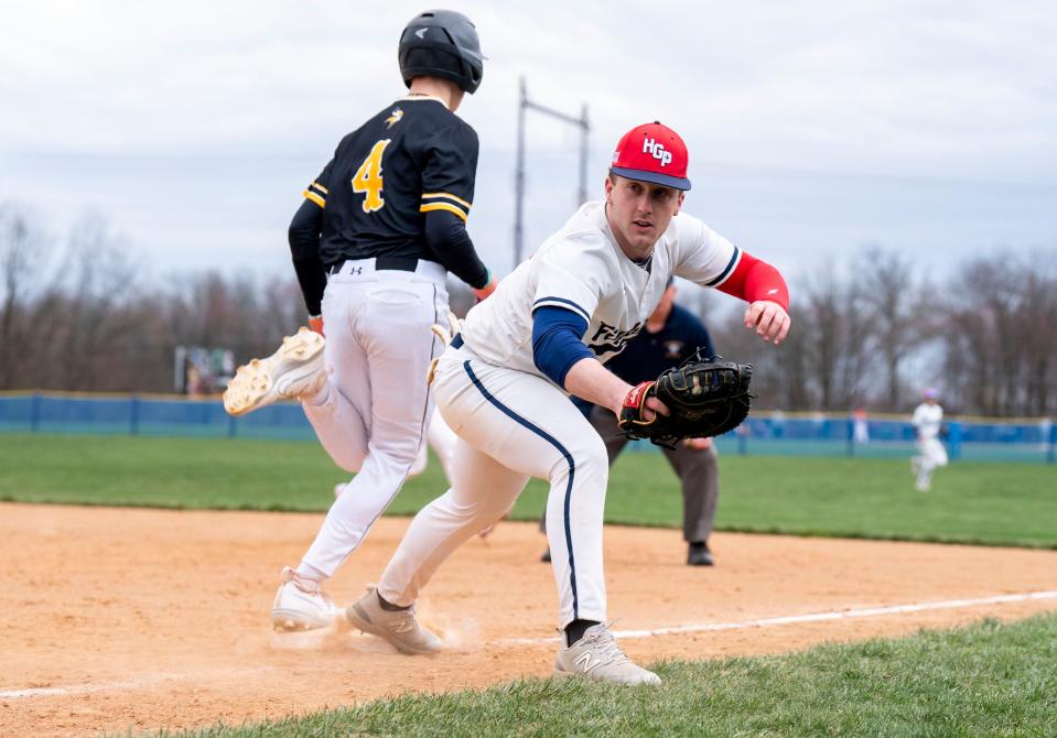 Holy Ghost Prep's Joseph Amati (17) makes the play to tag out Archbishops Wood's Sebastian McNab (4) at first base during their non-league baseball game in Bensalem on Friday, March 22, 2024.