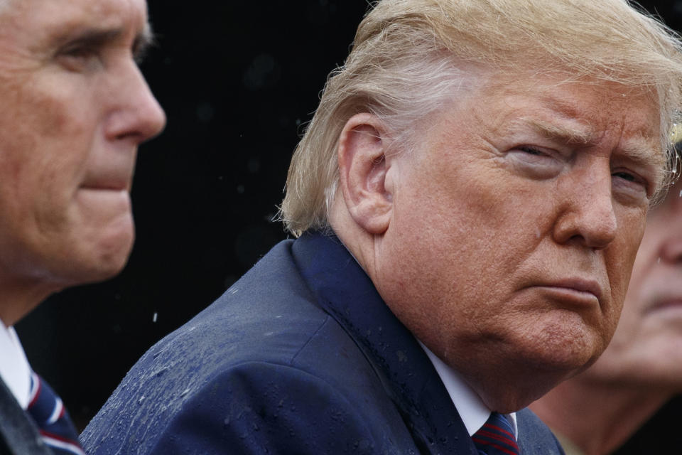 President Donald Trump and Vice President Mike Pence participate in an Armed Forces welcome ceremony for the new chairman of the Joint Chiefs of Staff, Gen. Mark Milley, Monday, Sept. 30, 2019, at Joint Base Myer-Henderson Hall, Va. (AP Photo/Evan Vucci)