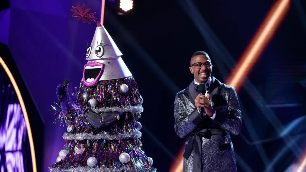  Nick Cannon with a tree in The Masked Singer. 