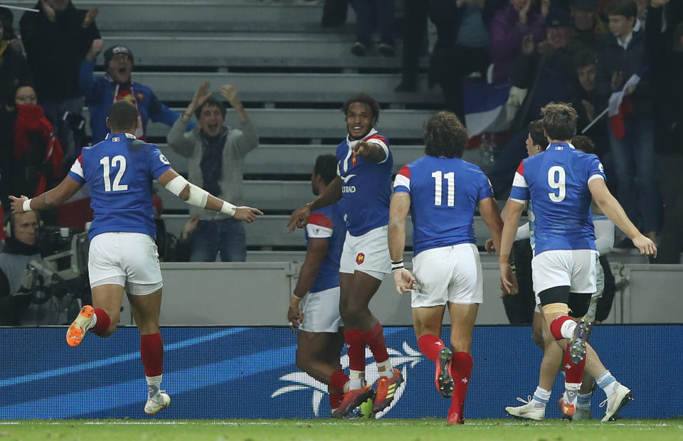 French rugby players celebrate a try during the rugby union international match between France and Argentina at the Pierre Mauroy stadium, in Lille, northern France, Saturday, Nov. 17, 2018. (AP Photo/Christophe Ena)