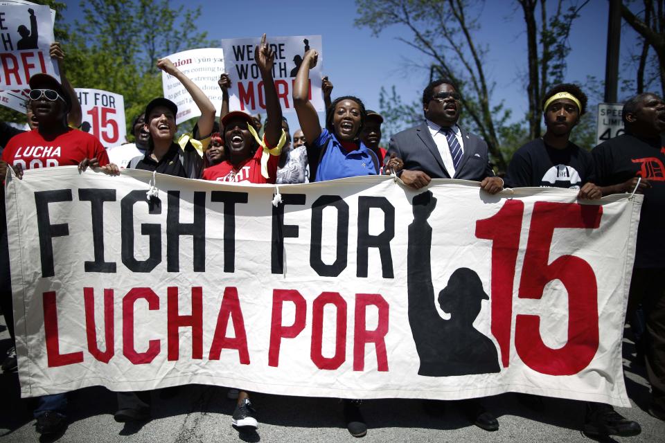 Demonstrators march during a protest near the McDonalds headquarters in Oak Brook, Illinois, May 21, 2014. (REUTERS/Jim Young)