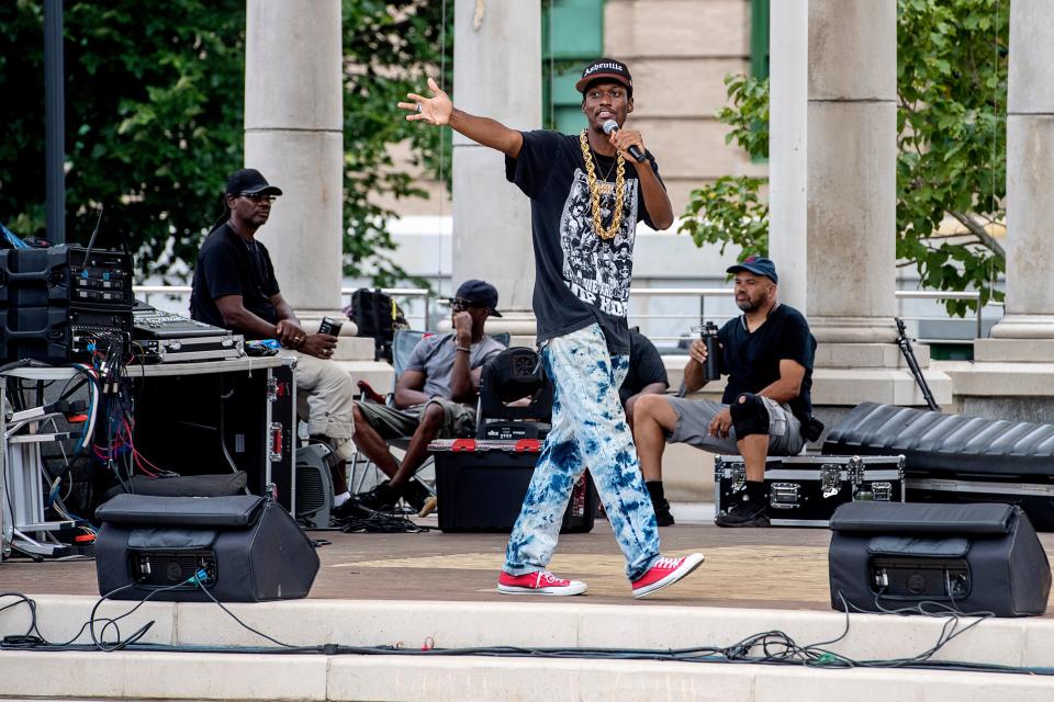 Asheville artist Eaze Dogg raps during Goombay Festival Sept. 3, 2022 in Asheville. The festival is one of several that celebrates African American culture in Asheville.