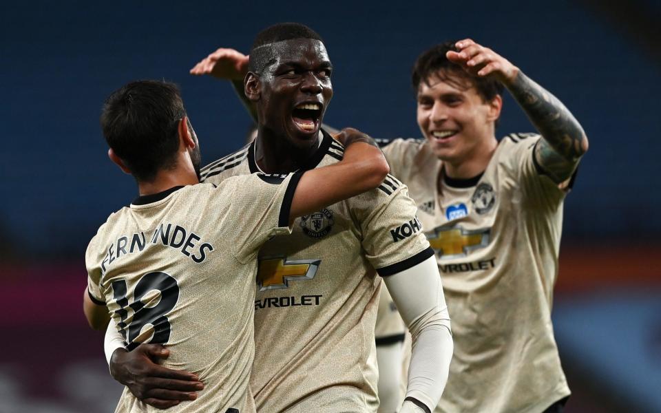 Paul Pogba of Manchester United celebrates with team mate Bruno Fernandes after scoring the third goal during the Premier League match between Aston Villa and Manchester United - Getty