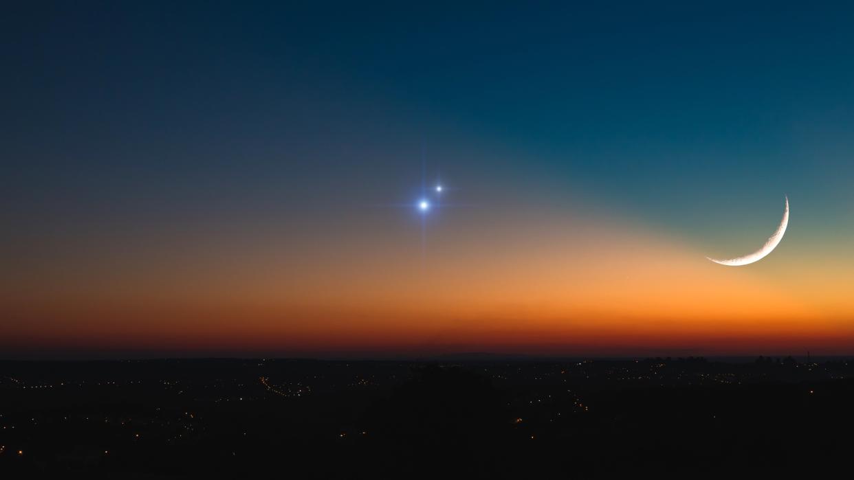  A planetary conjunction alongside a crescent moon 