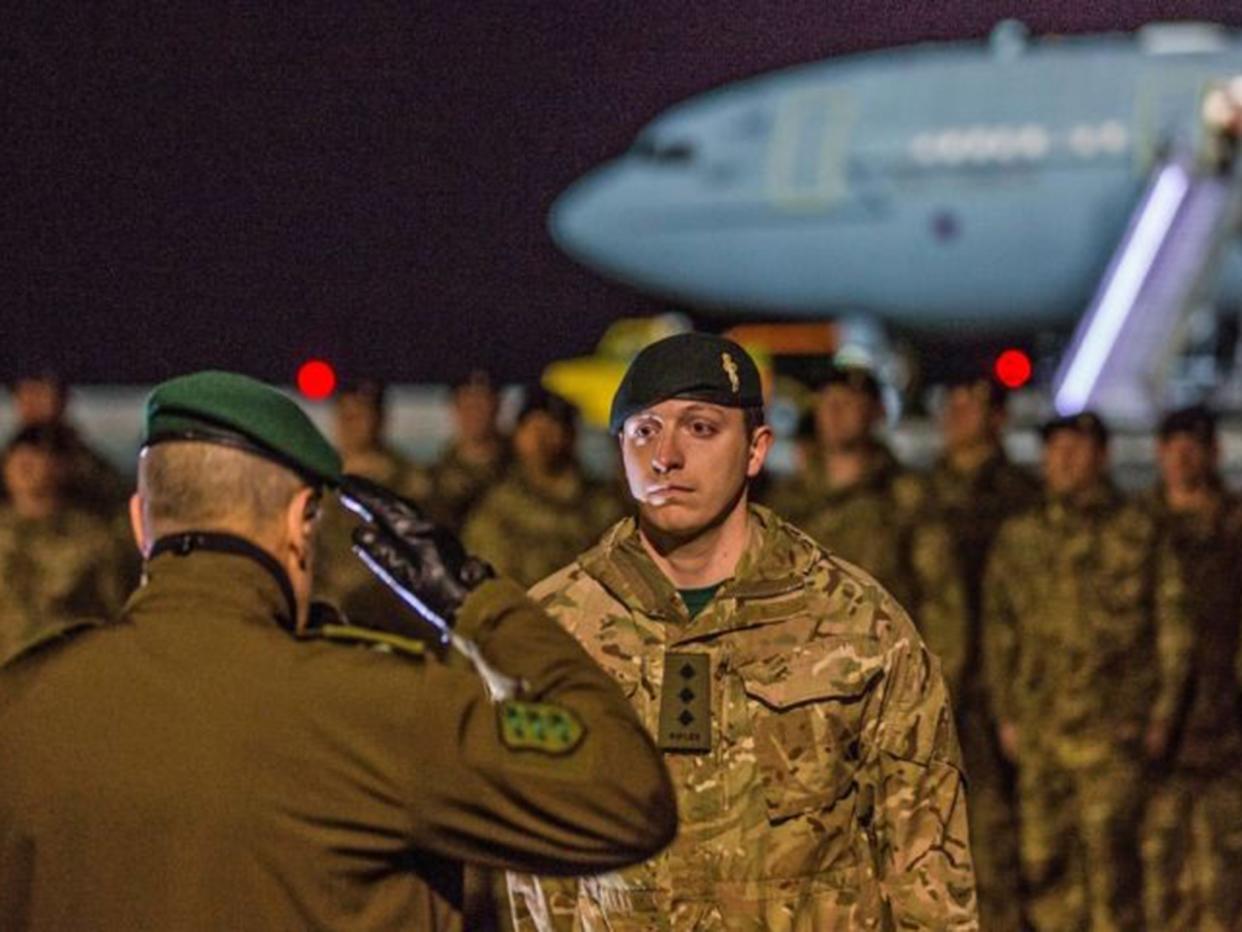 UK soldier receiving a salute as troops arrive at the Amari airbase, 25 miles south-west of Tallinn: PA