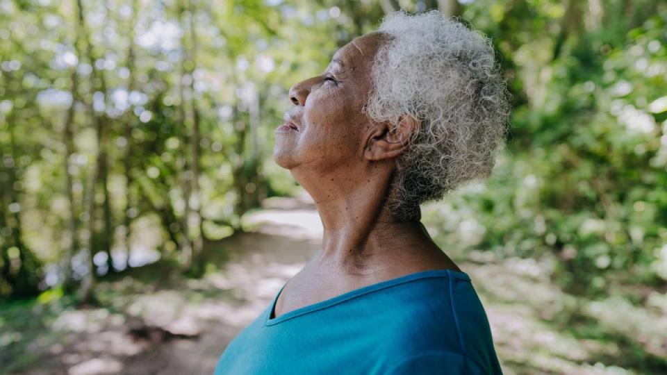 Mind Tricks: Portrait of a senior woman breathing fresh air