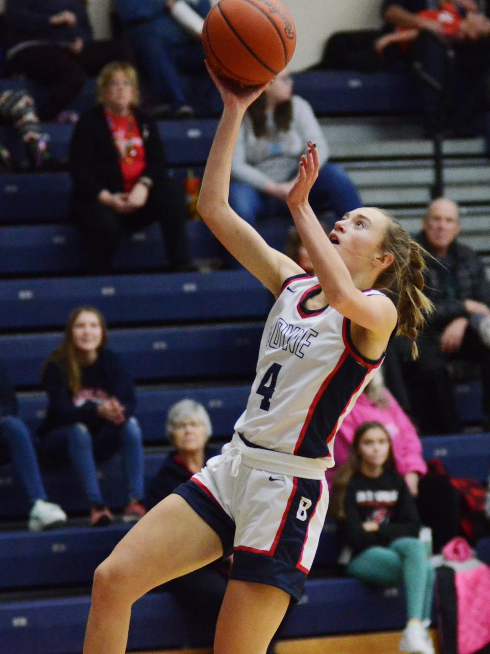 Boyne City's Ava Maginity finishes off a steal with a layup at the other end.