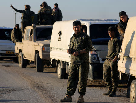 Fighters from the Syrian Democratic Forces (SDF) are pictured together near the village of Baghouz, Deir Al Zor province, in Syria March 9, 2019. REUTERS/Rodi Said