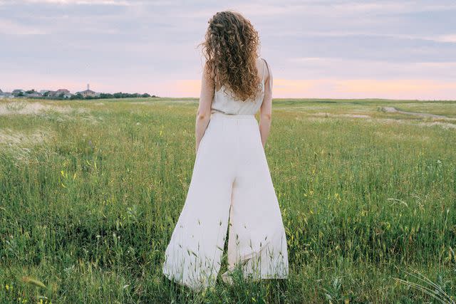 <p>Getty</p> A stock photo of a bridal jumpsuit