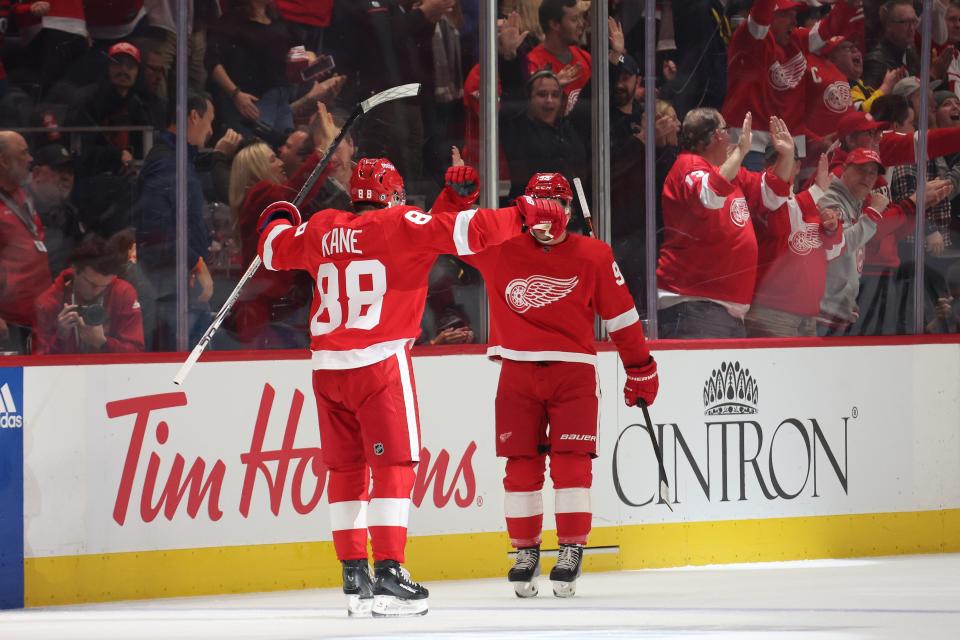 Patrick Kane of the Detroit Red Wings celebrates his first-period goal with Alex DeBrincat of the Detroit Red Wings while playing the Ottawa Senators at Little Caesars Arena on Dec. 9, 2023 in Detroit, Michigan.