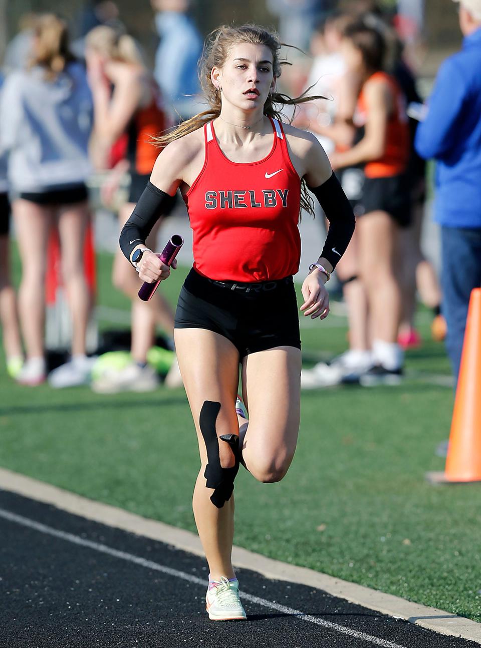 Shelby High School's Kayla Gonzales competes in the 4x800 relay at the Madison Track Invitational at Madison Comprehensive High School Thursday, March 30, 2023. TOM E. PUSKAR/ASHLAND TIMES-GAZETTE