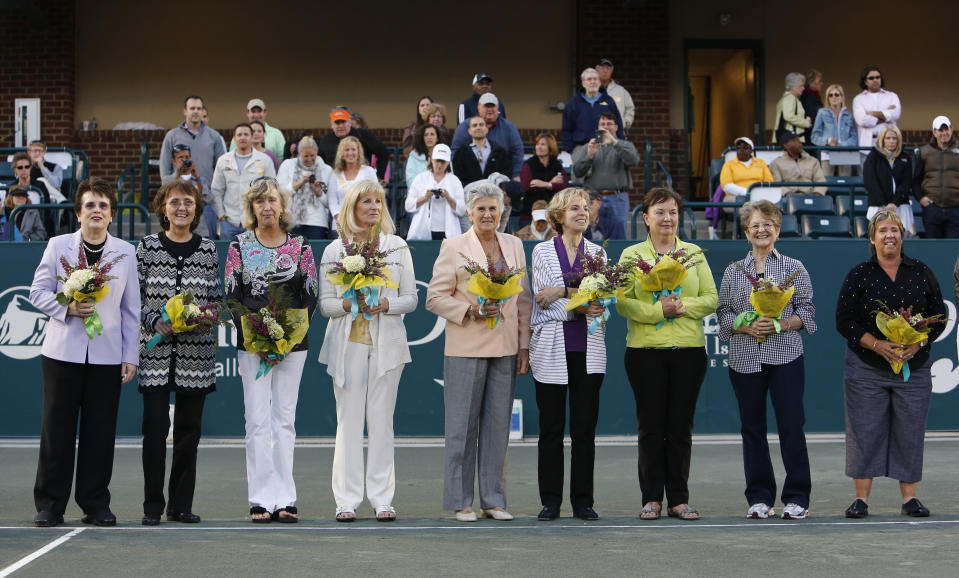 FILE - Members of the original nine women who helped start the Women’s Tennis Association from left to right, Billie Jean King, Peaches Bartkowicz, Kristy Pigeon, Valerie Ziegenfuss, Judy Tegart Dalton, Julie Heldman, Kerry Melville Reid, Nancy Richey and Rosie Casals, are honored at the Family Circle Cup tennis tournament in Charleston, S.C., April 7, 2012. Wednesday marks the 50th anniversary of the meeting on June 21, 1973, at the Gloucester Hotel — about a mile south of Hyde Park in the heart of the British capital — where King and nearly 60 other players agreed to form what today is known as the WTA. (AP Photo/Mic Smith, File)