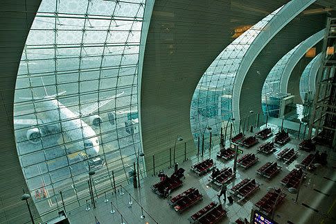 Passengers wait to board an A380 at the new concourse. Photos: AP