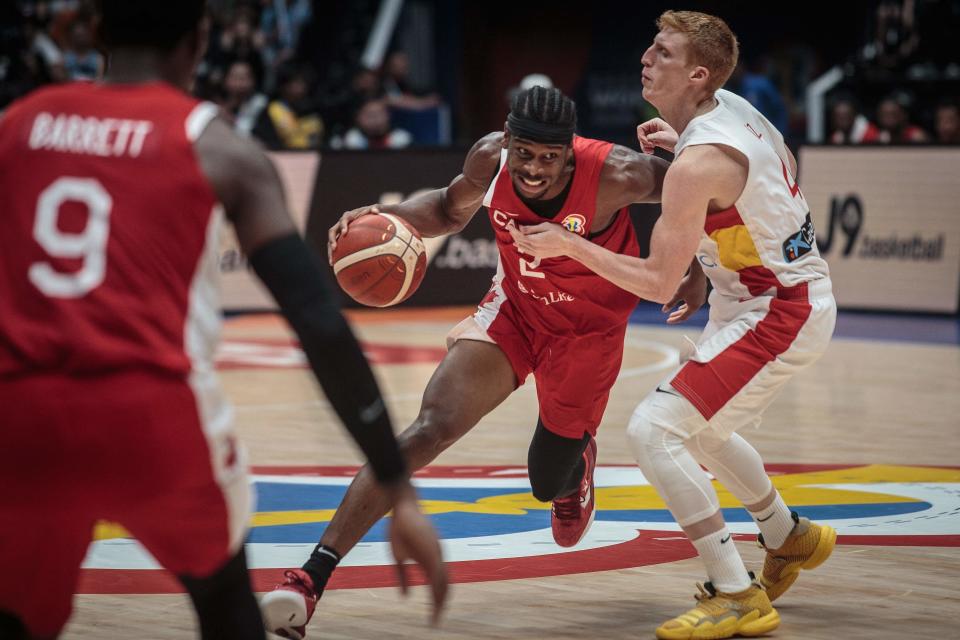 Canada’s Shai Gilgeous-Alexander (C) dribbles against Spain’s Alberto Diaz (R) during the FIBA Basketball World Cup group L match between Spain and Canda at Indonesia Arena in Jakarta on September 3, 2023. (Photo by AFP) (Photo by -/AFP via Getty Images)