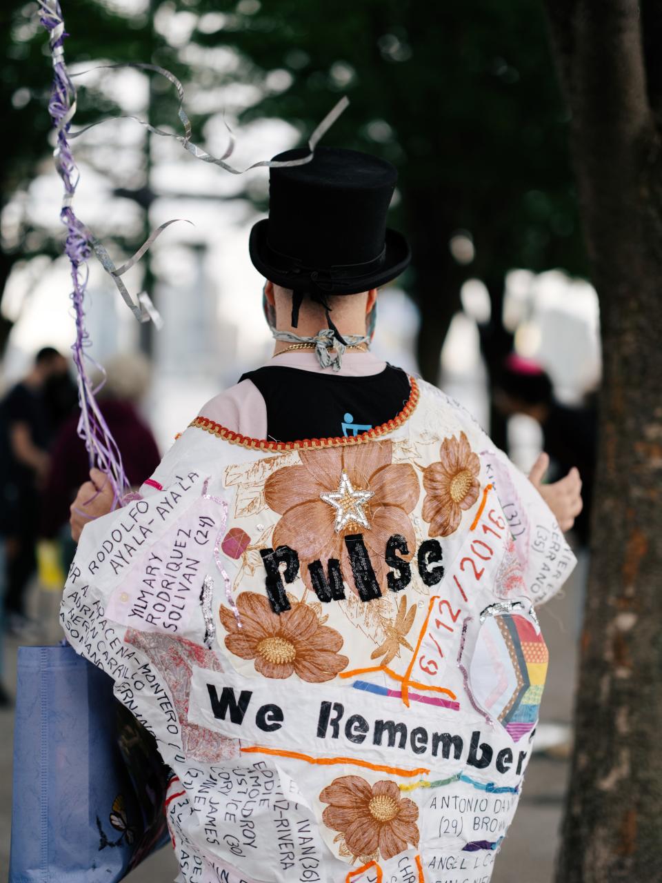 Michael Sylvan Robinson made a coat for the event with all 49 names written and stitched onto it.