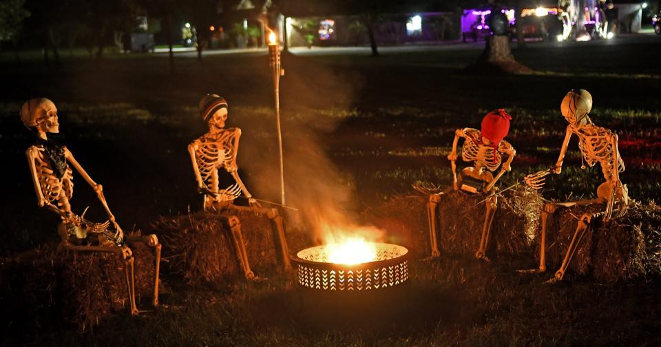 Good times at the campfire. An elaborate display at 4880 Tiger Lane in Mims includes carriages, pirates, ghouls, and about three dozen skeletons. Greg and Angela O'Leary have been setting this up in the Fall for the last four years, and it keeps growing. And to make the occasion better, Halloween is also Angelaa's birthday.

Syndication Florida Today