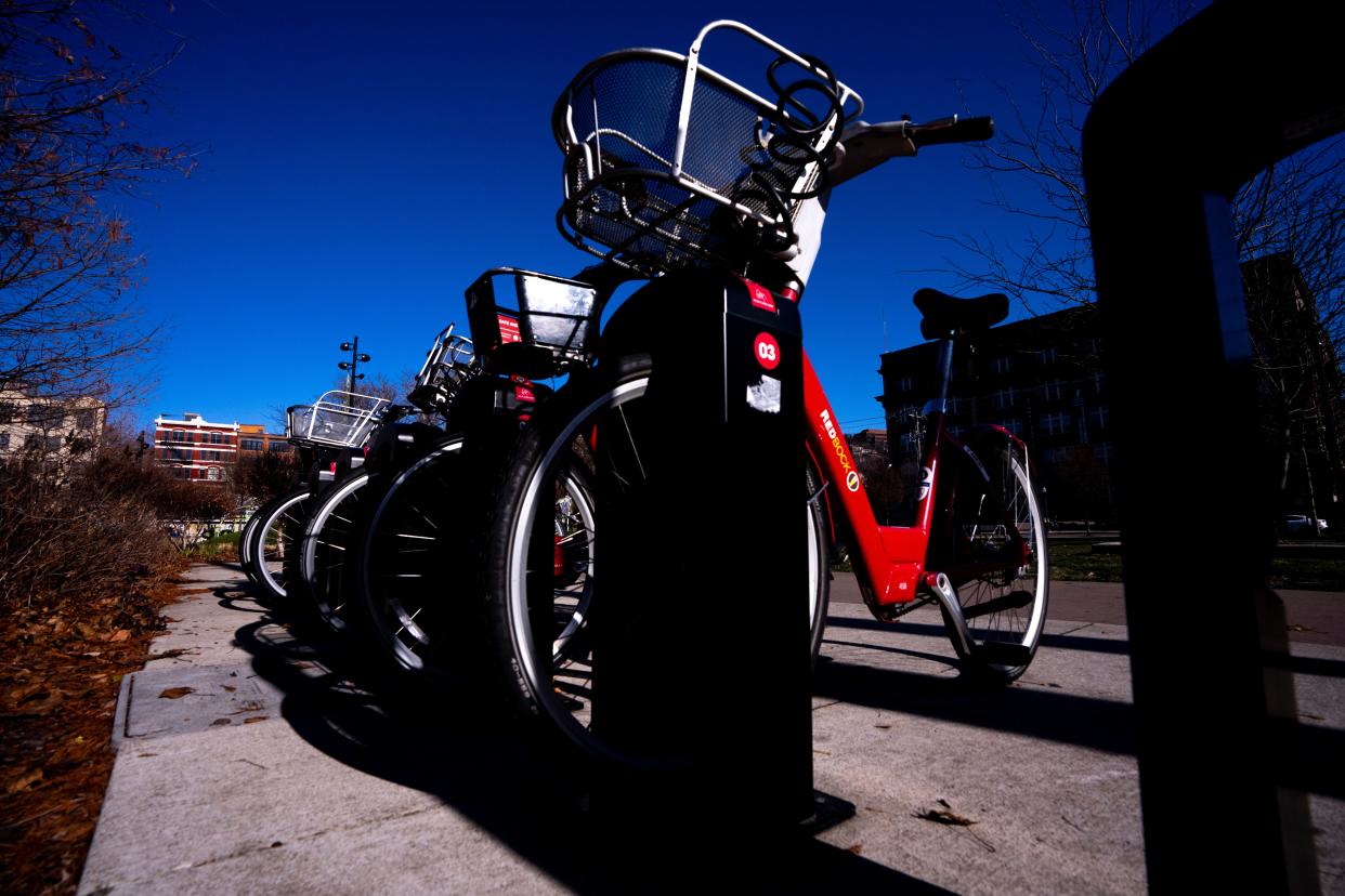 Red Bikes parked at Ziegler Park in Over-The-Rhine on Tuesday, Dec. 19, 2023. Cincinnati Red Bike will pause service in January until spring.