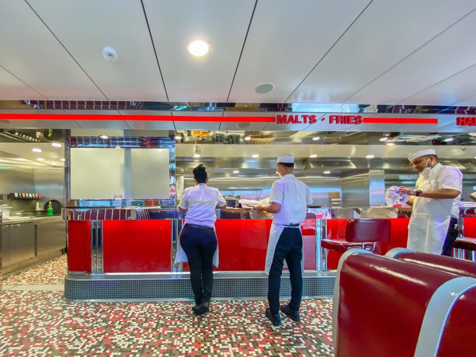 Employees wait for orders at Johnny Rockets