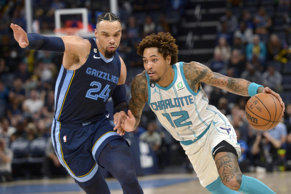 Charlotte Hornets guard Kelly Oubre Jr. (12) drives against Memphis Grizzlies forward Dillon Brooks (24) during the first half of an NBA basketball game Friday, Nov. 4, 2022, in Memphis, Tenn. (AP Photo/Brandon Dill)