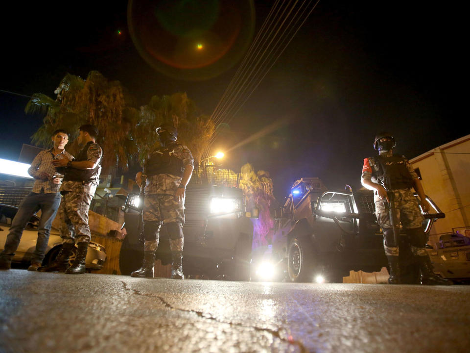 Security forces stand guard outside the Israeli embassy in the Rabiyeh neighbourhood of the Jordanian capital Amman following a security incident on 23 July 2017: AFP/Getty Images