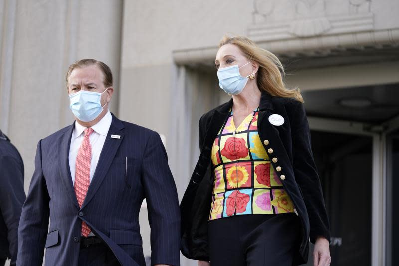 In this Oct. 14, 2020, file photo, Mark and Patricia McCloskey leave following a court hearing, in St. Louis. (AP Photo/Jeff Roberson, File)