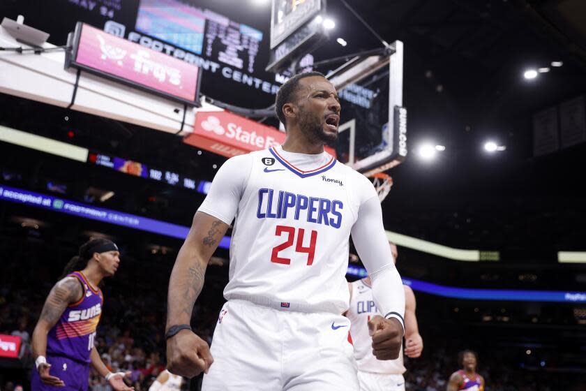 Clippers guard Norman Powell lets out a yell along the baseline after scoring against the Suns last season.