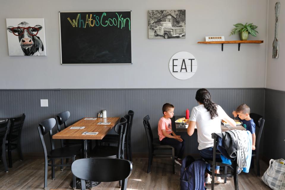 Marcy Cimoni and her twin boys, Henry and Theo, 5, enjoy breakfast at the newly opened What's Cookin on Acushnet Avenue in New Bedford.