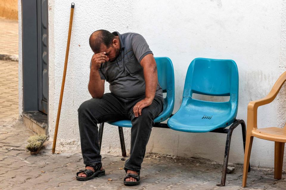 A relative of a Palestinian killed in an airstrike mourns at a hospital in Rafah (AFP via Getty Images)