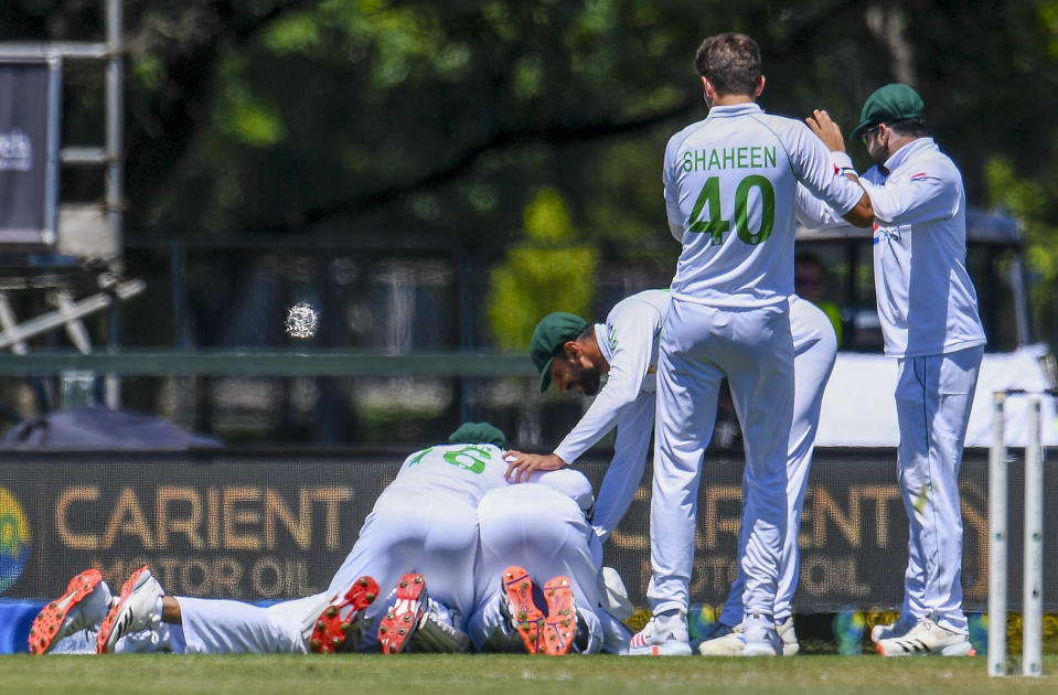 Pakistan players celebrate the wicket of New Zealand's Tom Latham during play on day two of the second cricket test between Pakistan and New Zealand at Hagley Oval, Christchurch, New Zealand, Monday, Jan 4. 2021. (John Davidson/Photosport via AP)