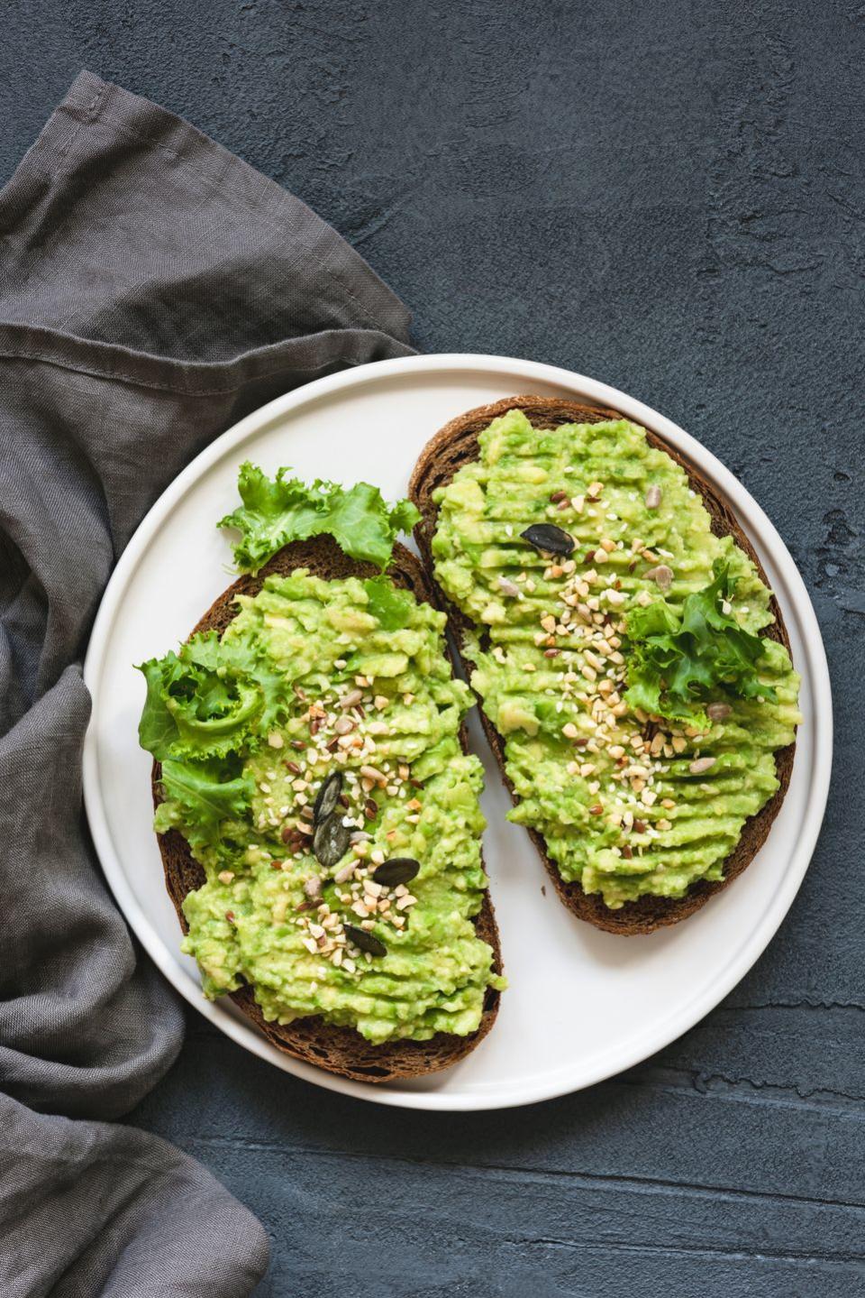 healthy toast with mashed avocado and seeds