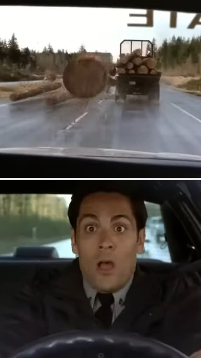 Log transporting truck spills logs onto the road in front of shocked driver in a scene from the movie 