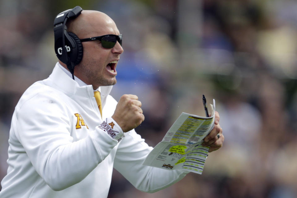 FILE - In this Sept. 28, 2019, file photo, Minnesota head coach P.J. Fleck celebrates a touchdown during the first half of an NCAA college football game against Purdue in West Lafayette, Ind. With another Gophers player opting out of the season Monday, coach P.J. Fleck warned more could follow before the Oct. 24 opener. (AP Photo/Michael Conroy, File)