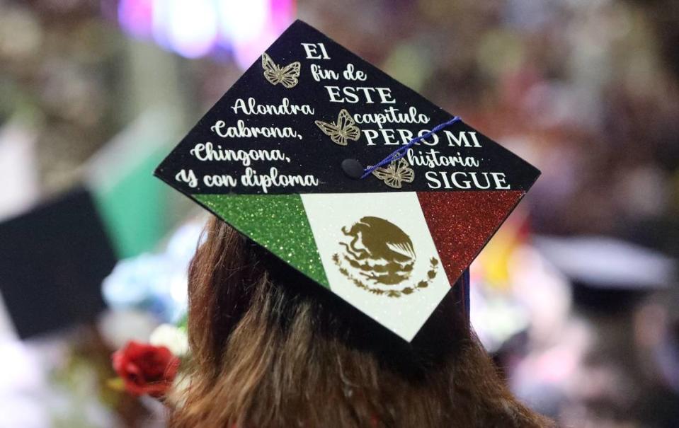 A graduate sends a message on the top of her mortar board during the 48th Fresno State Chicano/Latino Commencement Celebration on May 18, 2024.