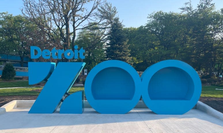 A new 18-foot-wide photo op has been installed outside the Detroit Zoo's main gates, featuring the zoo's new logo.