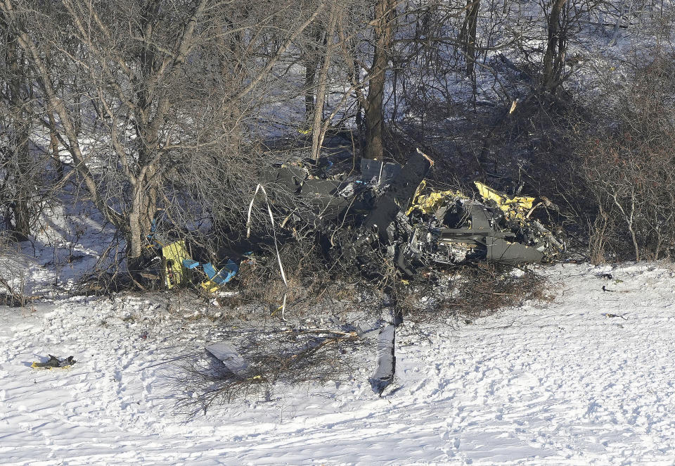 This aerial photo shows the crash site of a Minnesota National Guard Blackhawk helicopter, Friday Dec. 6, 2019, near Kimball, Minn. Three soldiers were killed in Thursday's crash at the edge of a farm field about 30 miles south of St. Cloud. (Brian Peterson/Star Tribune via AP)