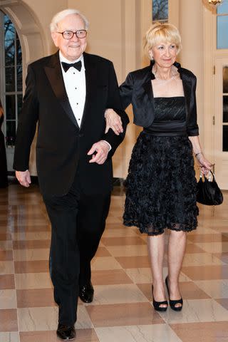 <p>Brendan Hoffman/Getty</p> Warren Buffet and Astrid M. Buffett arrive for a State Dinner in honor of British Prime Minister David Cameron at the White House on March 14, 2012.