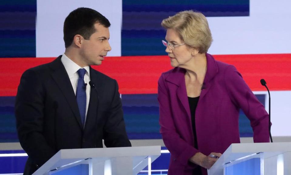 Pete Buttigieg talks with his leftwing rival Senator Elizabeth Warren during the Democratic presidential debate in Atlanta, Georgia, on 20 November.