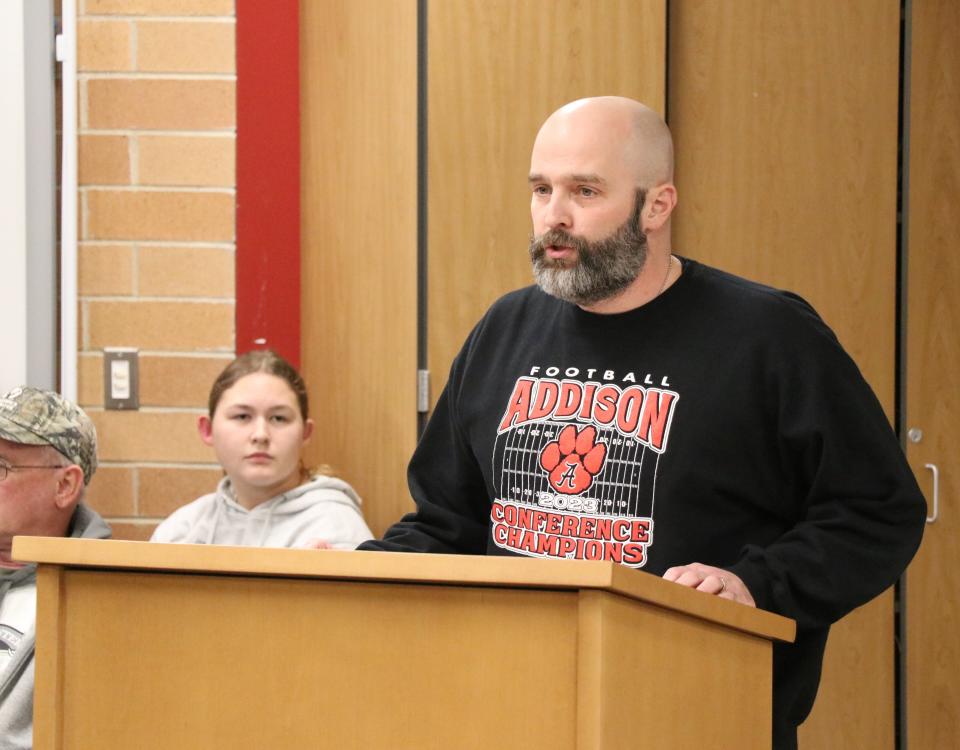 Josh Lindeman announces his resignation as athletic director, assistant principal and head football coach Monday, Dec. 18, 2023, at the Addison Community Schools Board of Education meeting.