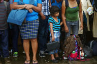 A Honduran migrant, part of a caravan trying to reach the U.S., holds a bible during a new leg of their travel in Mazatenango, Guatemala October 18, 2018. REUTERS/Edgard Garrido