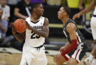 Colorado guard McKinley Wright IV, left, looks to pass the ball as Washington State guard Jervae Robinson defends in the first half of an NCAA college basketball game Thursday, Jan. 23, 2020, in Boulder, Colo. (AP Photo/David Zalubowski)