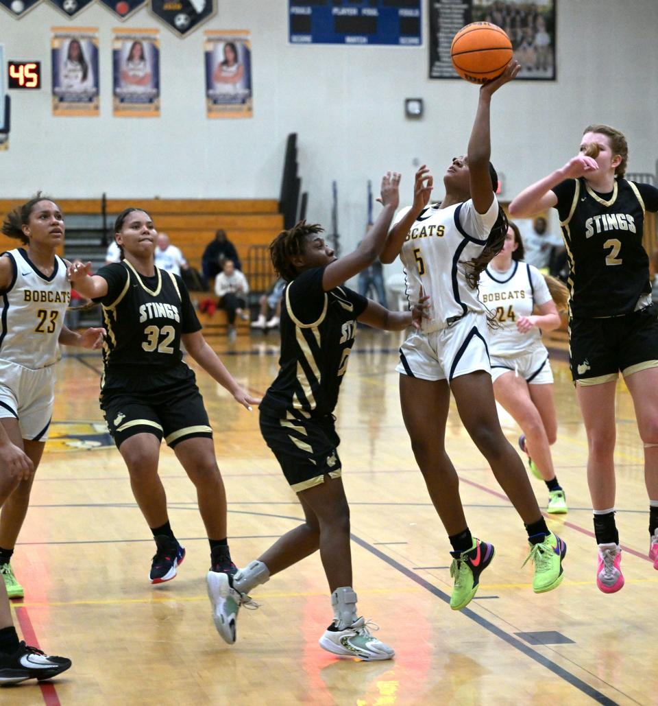 Boca Raton's Courtney Lowe goes up for a basket in the paint during a regional semifinals match against Miami on Feb. 19 2024.