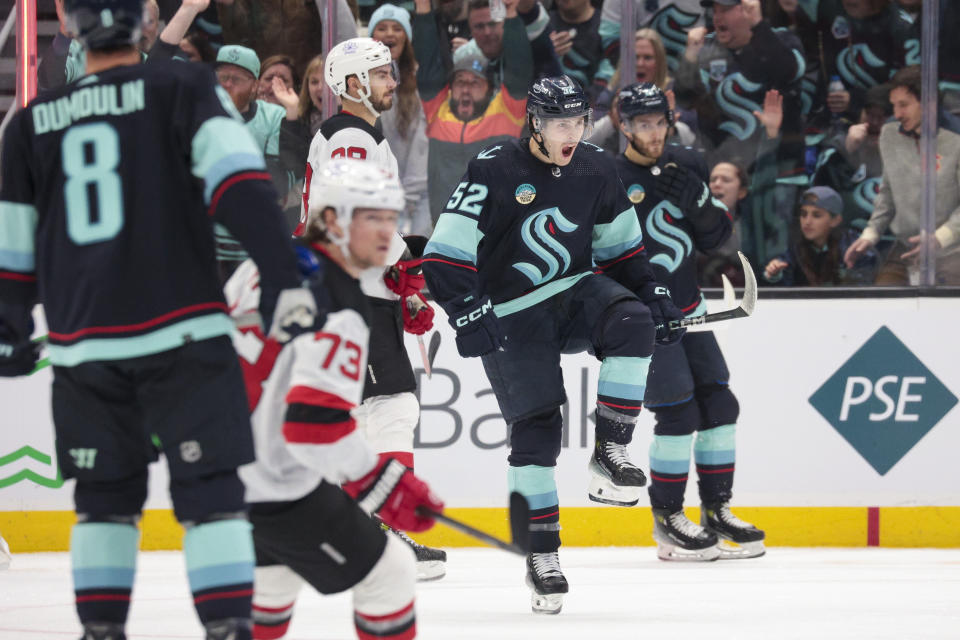 Seattle Kraken left wing Tye Kartye (52) reacts after scoring a goal against the New Jersey Devils during the second period of an NHL hockey game Thursday, Dec. 7, 2023, in Seattle. (AP Photo/Jason Redmond)